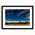 Abstract art print of Adelaide scenery in vibrant colors on a large textured canvas, framed in black.