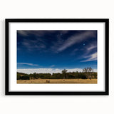 Abstract art print of Adelaide scenery in vibrant colors on a large textured canvas, framed in black.