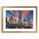 Textured abstract art print of Melbourne skyline in muted gold and blue tones on a framed canvas, suitable for bedroom decor.