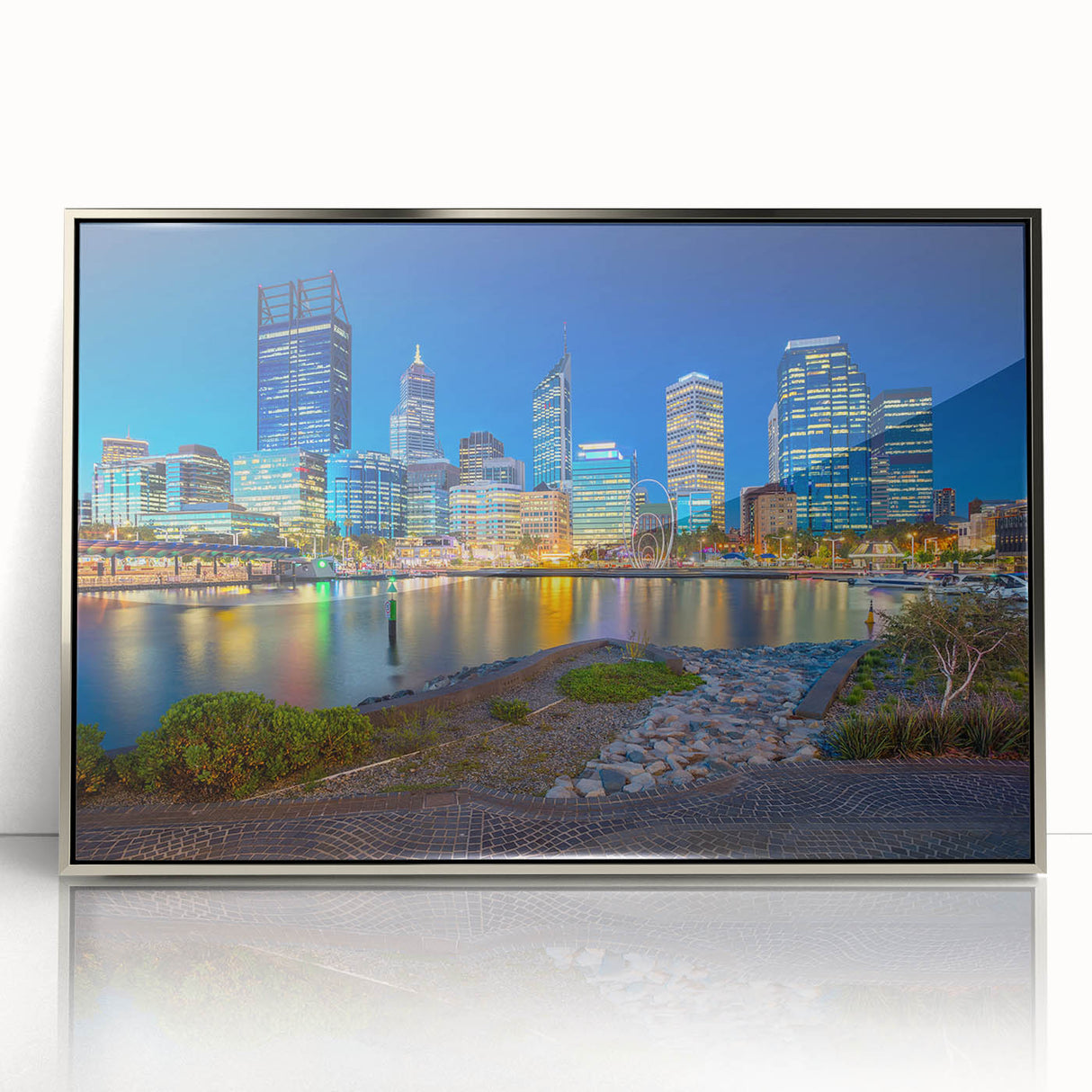 Art deco poster of Perth skyline in silver acrylic frame, featuring cool blue and gray tones.