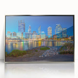 Art deco poster of Perth skyline in silver acrylic frame, featuring cool blue and gray tones.