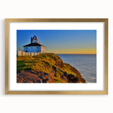 Extra large abstract art print featuring textured scenery of Newfoundland in muted earth tones, framed in gold.