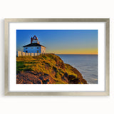 Textured art print of Newfoundland scenery in abstract style, featuring muted earth tones, framed in silver.