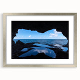 Extra large abstract art print depicting a Caribbean seascape in vibrant blue and teal hues, framed in silver.