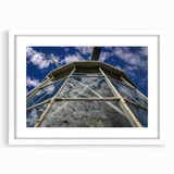Extra large textured abstract art print depicting Caribbean scenery in muted blues and greens, framed with a white mat.