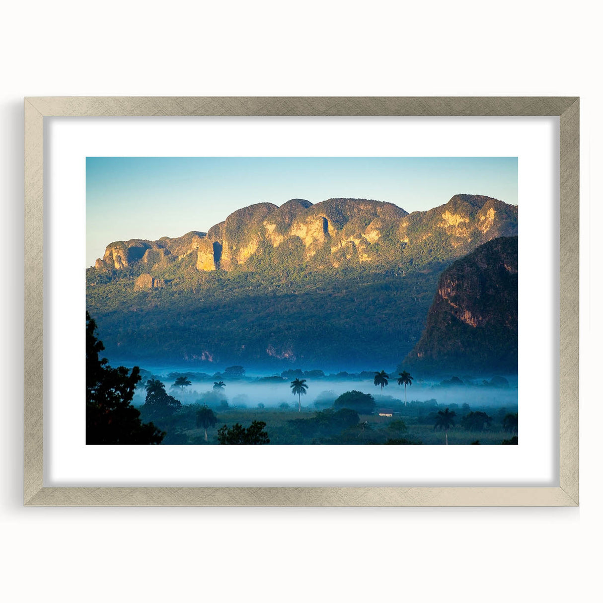 Extra large abstract art print of Caribbean scenery in silver frame, featuring textured blue and green tones.