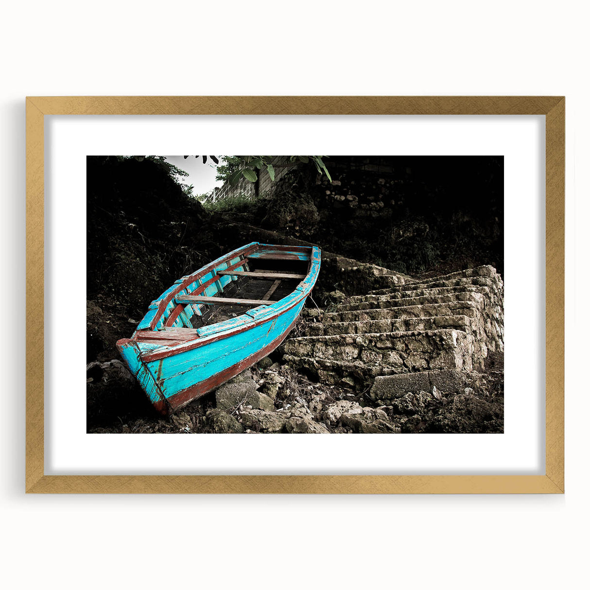 Textured abstract art print of Caribbean scenery in muted blue and green tones, framed in gold, suitable for bedroom decor.
