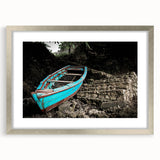 Abstract art print depicting Caribbean scenery in vibrant blue and green hues, framed in silver.