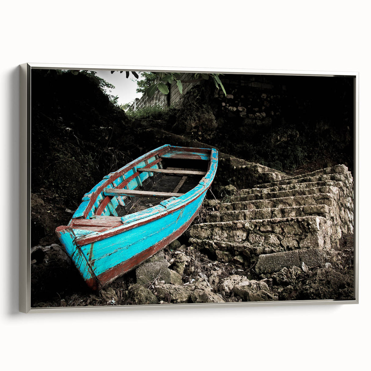 Framed canvas displaying a vintage-style landscape painting of the Caribbean with a silver frame, ideal for bedroom wall art.