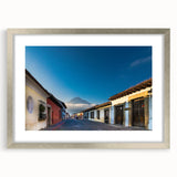 Textured abstract art print of a Central American scenery in muted earth tones, framed in silver, ideal for bedroom art.