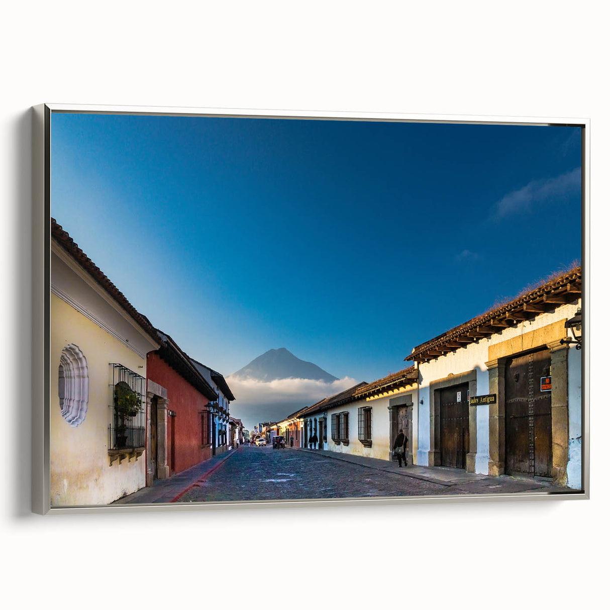 Landscape art painting of a Guatemalan rural scene in vibrant colors on a silver-framed canvas.