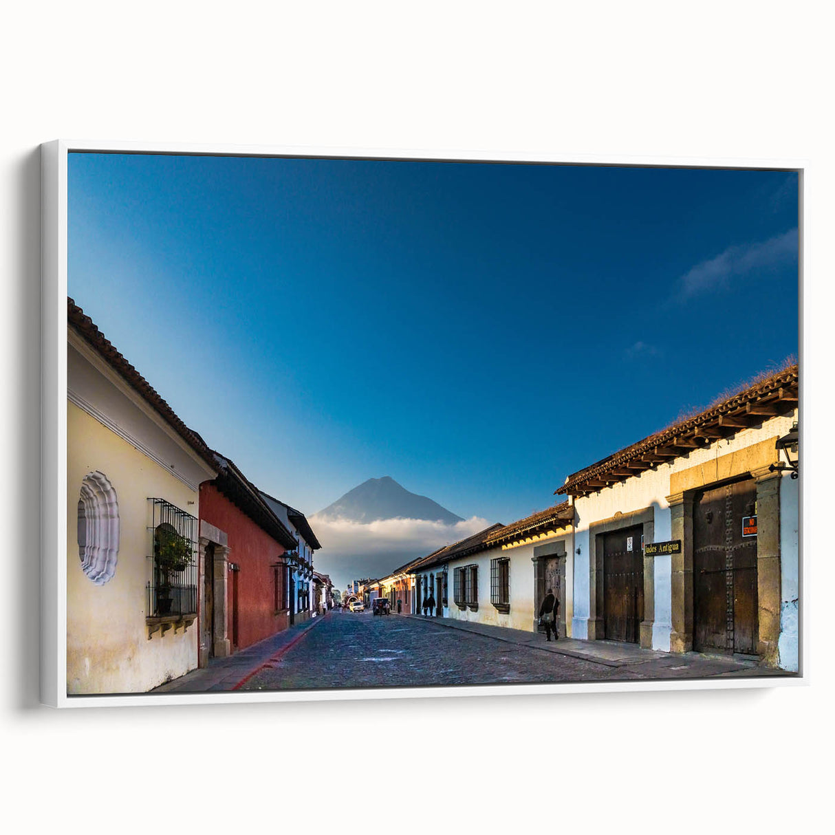 Framed canvas of a vintage poster art depicting a colorful Central American scenery.