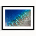 Abstract art print featuring vibrant, colorful textures, set in a black frame with mat, ideal for living room decor.