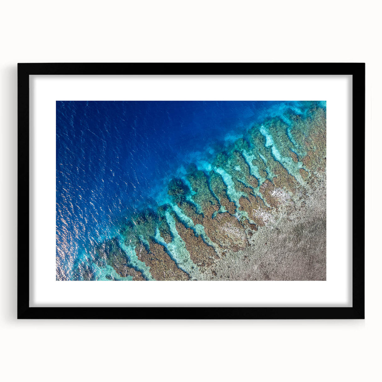 Abstract art print featuring vibrant, colorful textures, set in a black frame with mat, ideal for living room decor.
