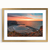 Abstract art print of a European scenery in muted gold and blue tones, framed with a gold mat, ideal for dining room decor.