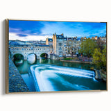 Framed canvas featuring a vintage-style landscape painting of Bath, England, in muted gold and black tones.