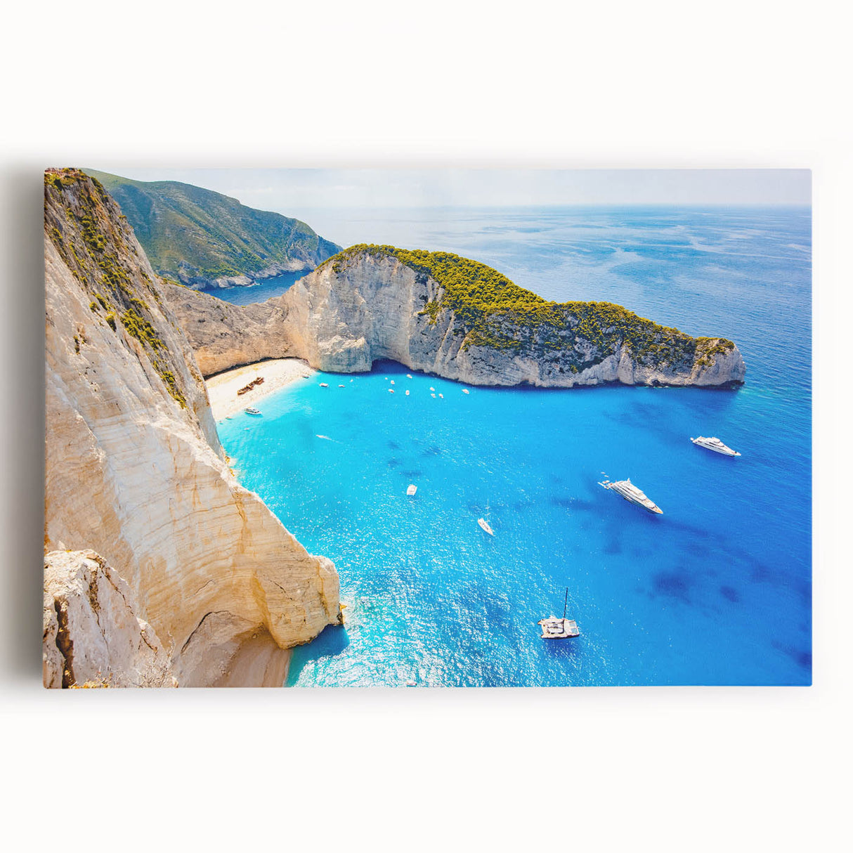 Large art featuring a black and white landscape painting of a Greek seaside on stretched canvas.