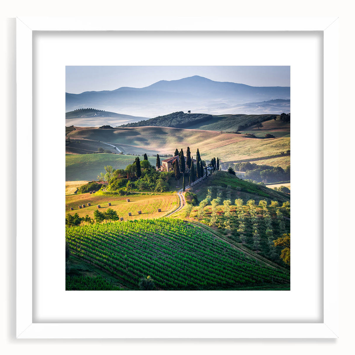 Textured art print of a Tuscan landscape in muted earth tones on a white framed canvas, suitable for bedroom decor.