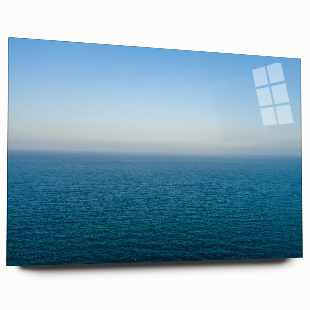 Large abstract wall art of the Mediterranean Sea in muted blue tones on acrylic glass.