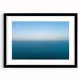 Colorful abstract art print of the Mediterranean Sea in vibrant hues on a large framed canvas, ideal for living room decor.