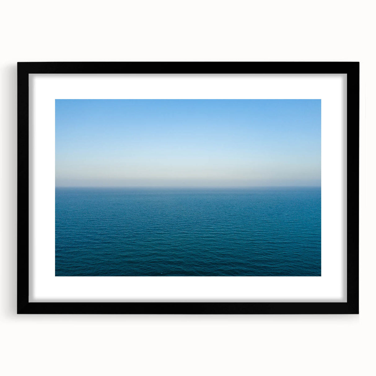 Colorful abstract art print of the Mediterranean Sea in vibrant hues on a large framed canvas, ideal for living room decor.