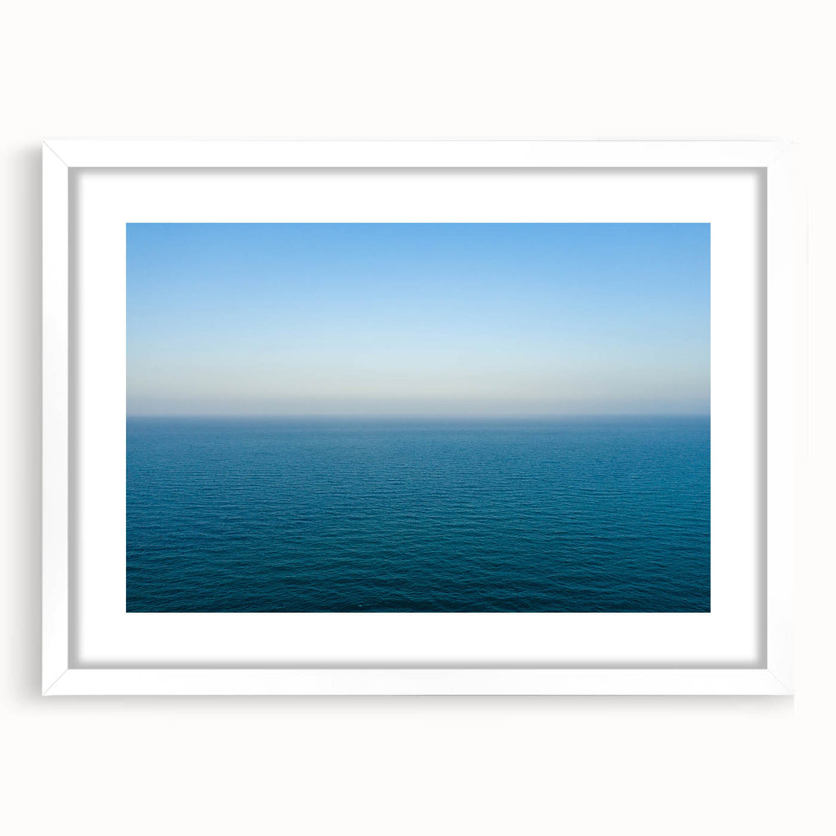 Textured art of the Mediterranean Sea in abstract style, featuring soft blue and white tones on a framed canvas.