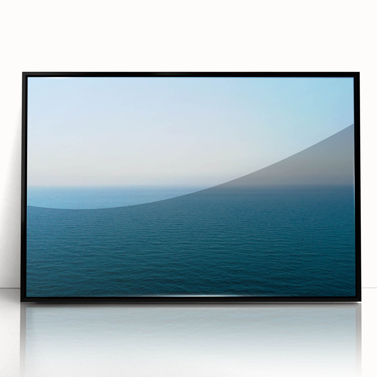Large abstract wall art depicting the Mediterranean Sea in blue tones, framed in black acrylic.