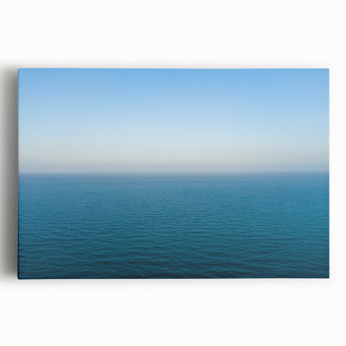 Black and white stretched canvas featuring a Mediterranean seaside scene, suitable as kitchen wall art or for a bedroom.