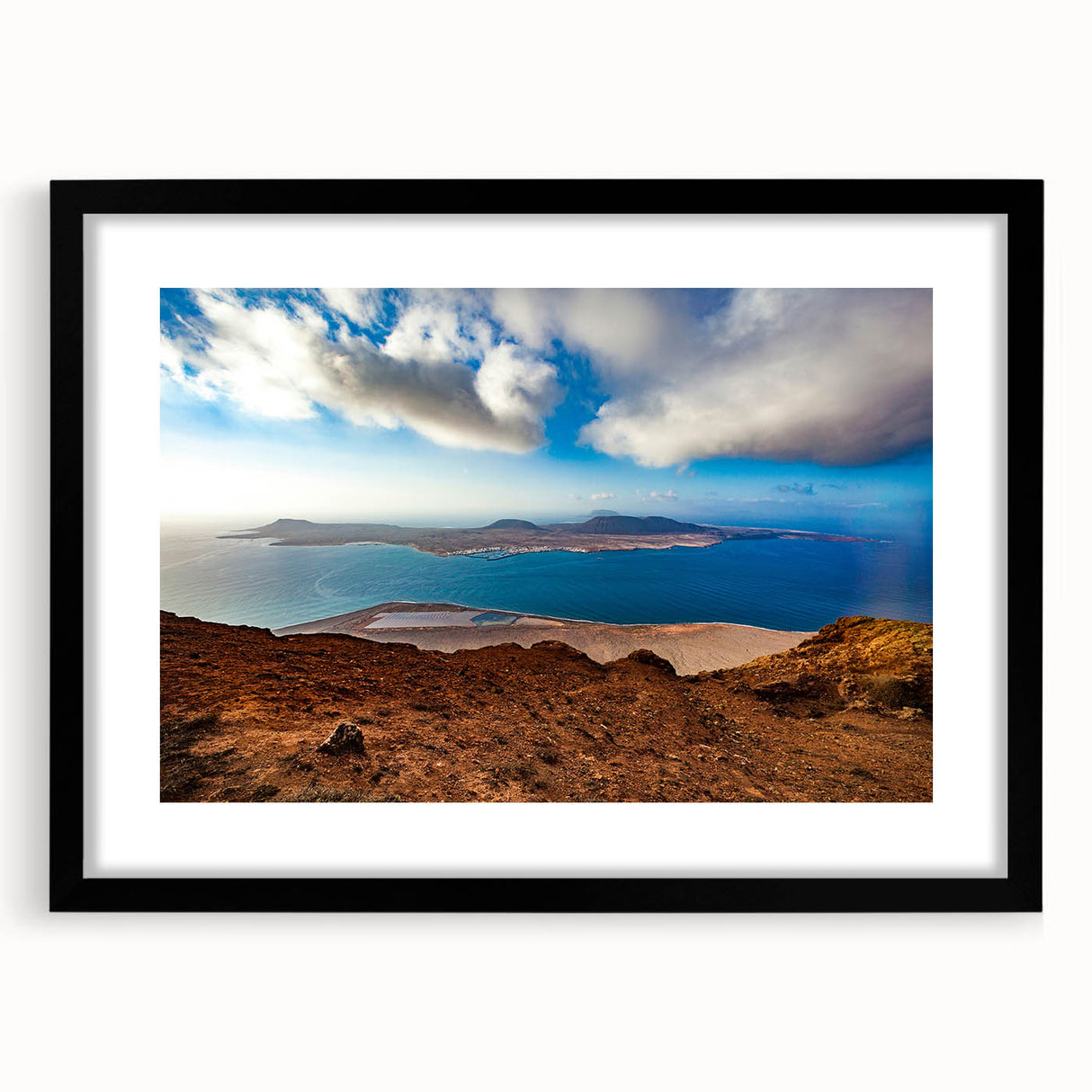 Extra large abstract art print featuring a colorful, textured depiction of a European scenery, framed in black.