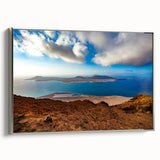 Framed canvas depicting a vintage-style landscape of the Canary Islands with vibrant colorful art and black borders.