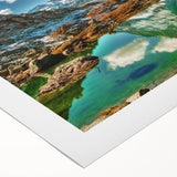 Art deco poster of a Swiss landscape in muted green and blue tones on rolled canvas, suitable for dining room decor.