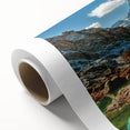 Art deco poster of a Swiss landscape on rolled canvas, featuring muted earth tones, ideal for nursery wall art.