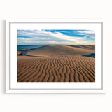 Abstract art print depicting the rugged landscapes of Baja California in muted earth tones, framed in white.