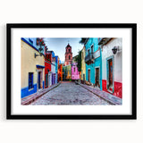 Abstract art print of Guanajuato scenery in vibrant colors on a textured, extra large canvas, framed in black.
