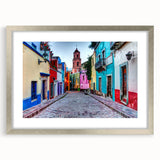 Textured abstract art print of Guanajuato, Mexico, in muted earth tones, framed in silver, ideal for bedroom decor.