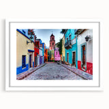 Abstract art print of Guanajuato with vivid blue and yellow tones on a framed white canvas, suitable for dining room decor.