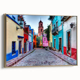 Framed canvas wall art featuring a vintage-style landscape painting of Guanajuato, Mexico in muted gold and black tones.