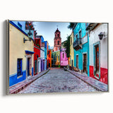 Framed canvas featuring a vintage poster art style landscape of Guanajuato, Mexico, with vibrant, colorful hues.