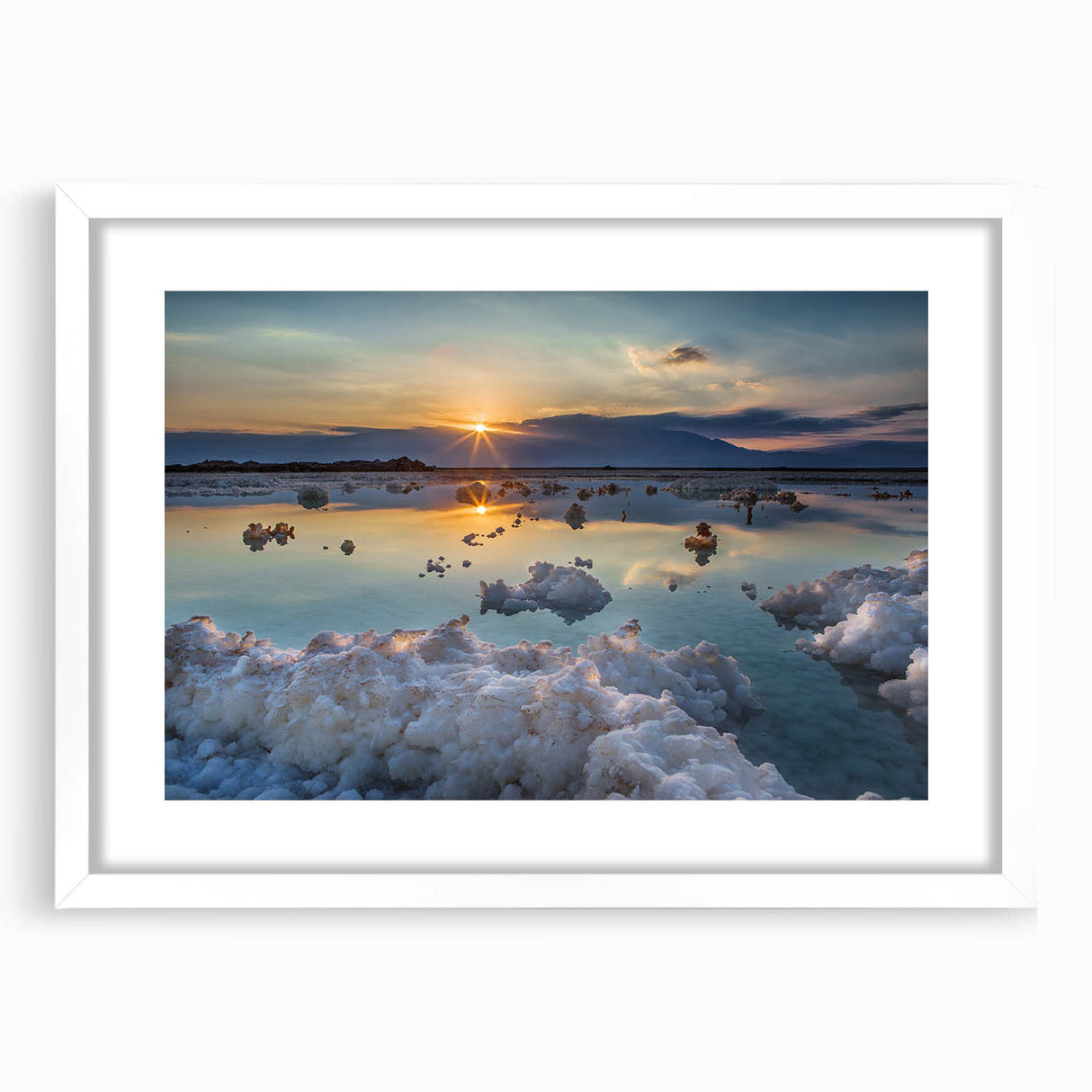 Abstract art print of the Dead Sea in muted blues and grays, framed with a white mat.