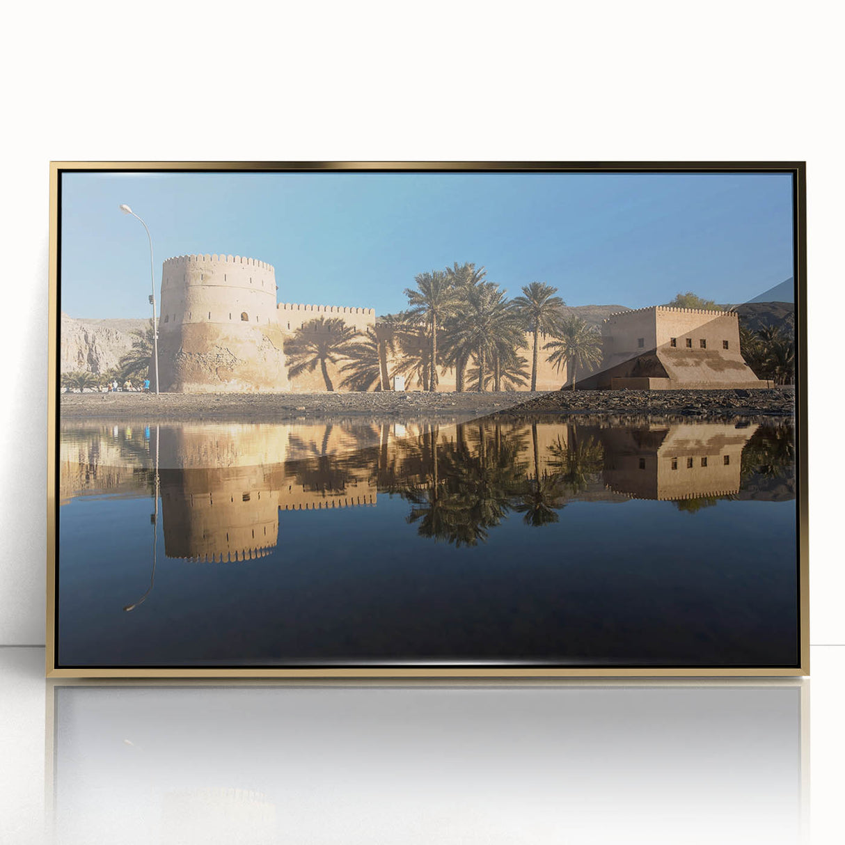 Large acrylic print of a Middle Eastern Oman scenery in gold tones, framed, ideal for modern art wall decor.