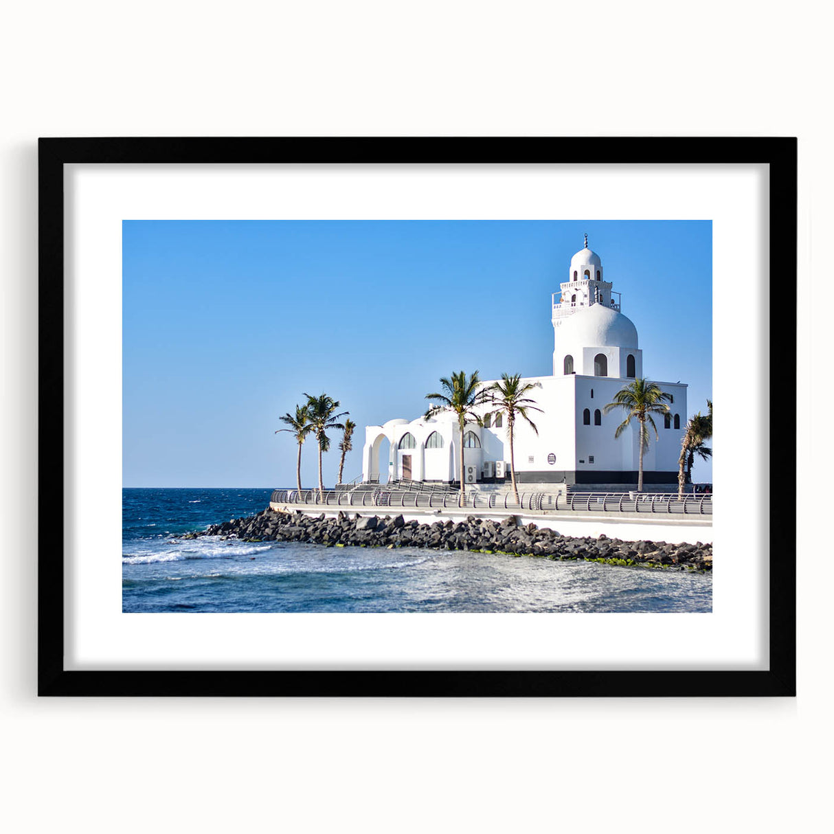 Abstract art print of a colorful, textured Middle Eastern landscape on a large black-framed canvas.