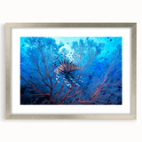 Textured art depicting abstract oceanic waves in shades of blue and white, presented on a silver-framed canvas.