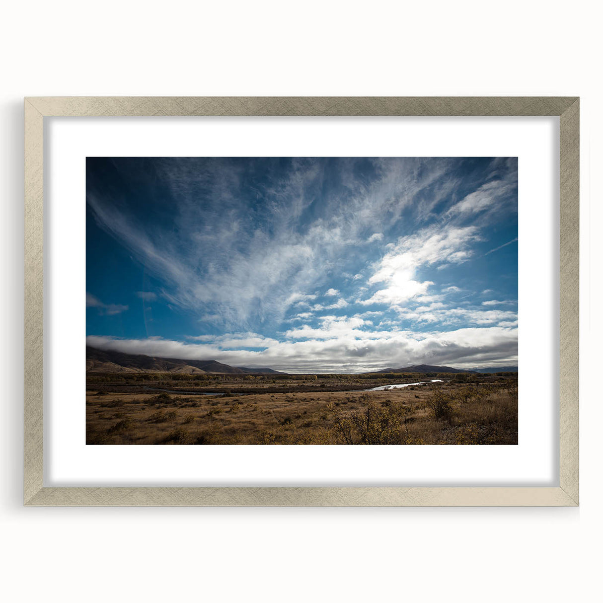 Textured abstract art print of Otago, New Zealand in silver frame, with a palette of cool blues and grays.