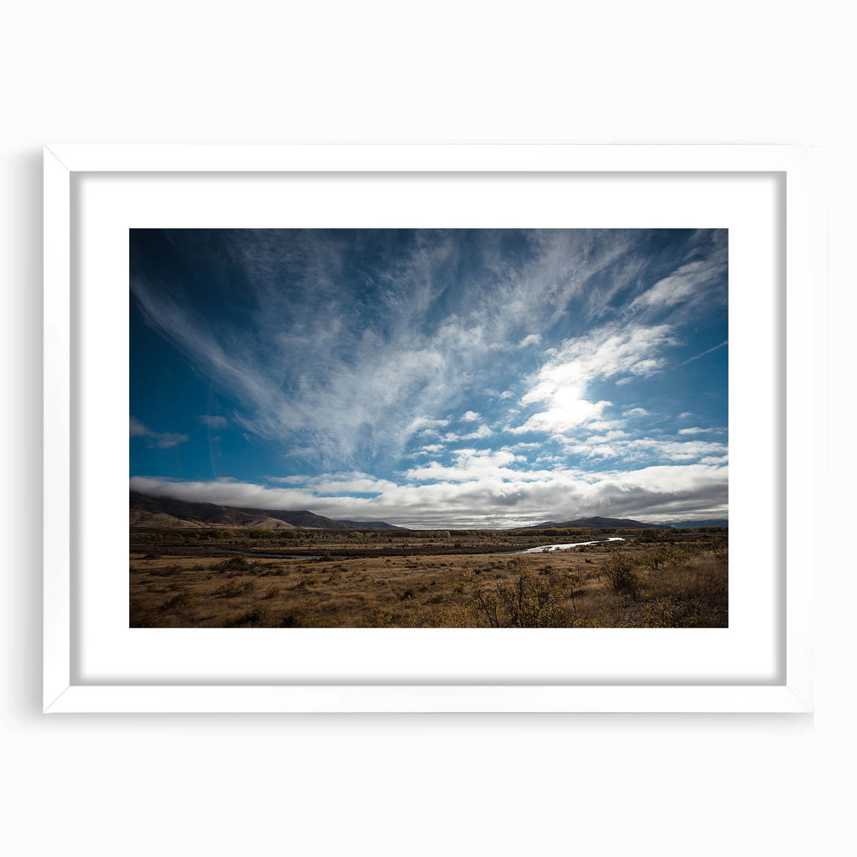 Abstract art print of Otago, New Zealand in muted blues and greens on a white framed canvas.