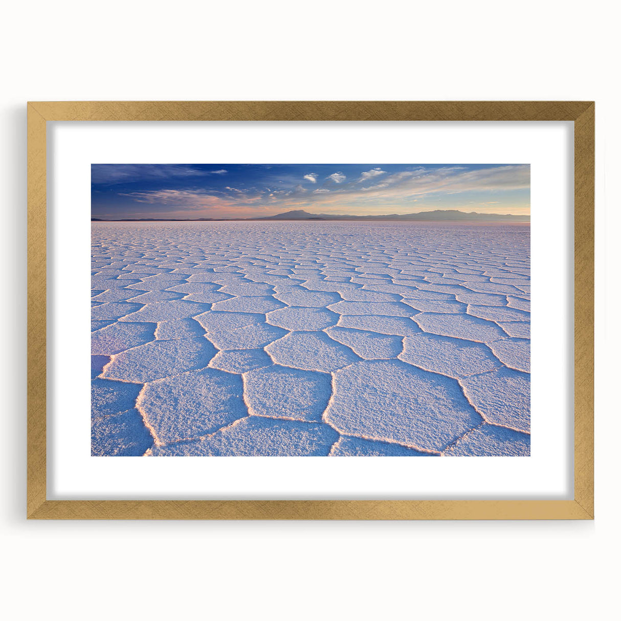 Abstract art print of a Bolivian landscape in textured gold frame, with earthy and blue tones, ideal for living room decor.