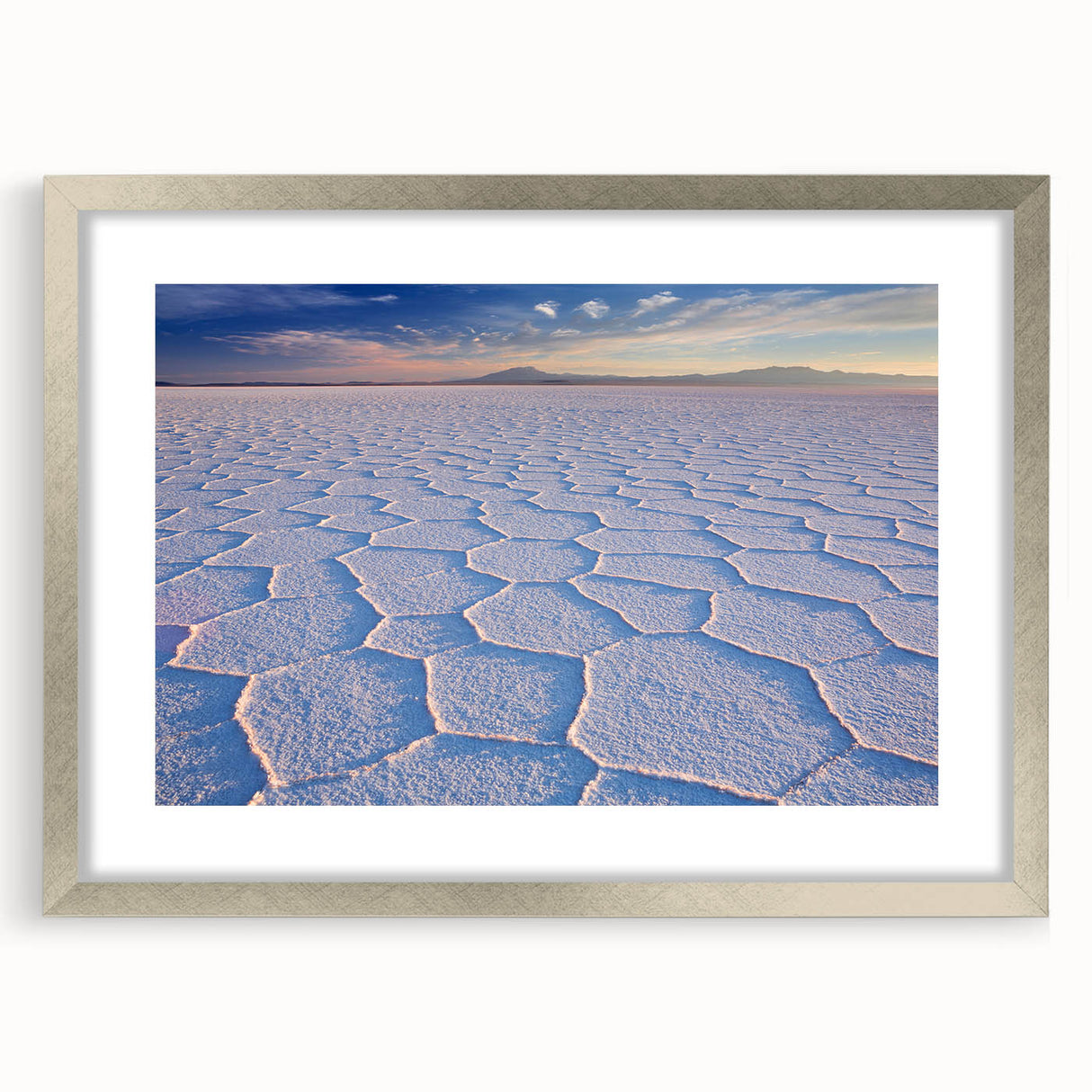 Textured abstract art print depicting a Bolivian landscape in muted earth tones, framed in silver, ideal for bedroom art.