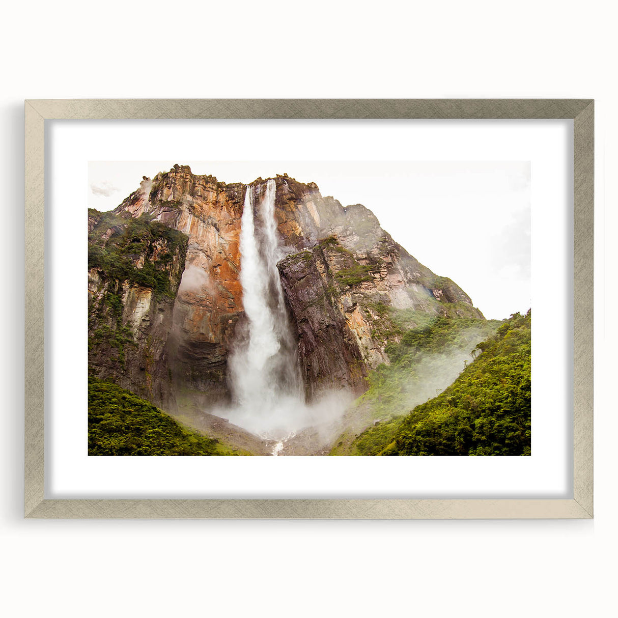 Textured abstract art print depicting a Venezuelan landscape in earth tones, framed in silver, suitable for bedroom decor.