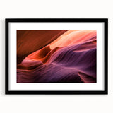 Extra large framed print of abstract Antelope Canyon in vibrant red and orange tones, ideal for living room decor.