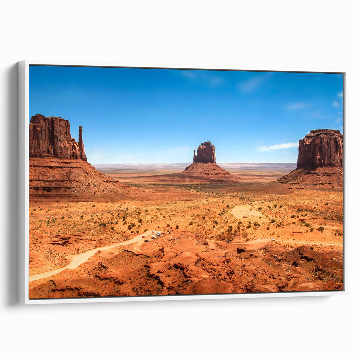 Vintage poster art of Monument Valley on framed canvas, featuring earthy tones, ideal for living room decor.