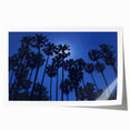 Rolled print of Beverly Hills scenery with floral elements in muted green and pink.